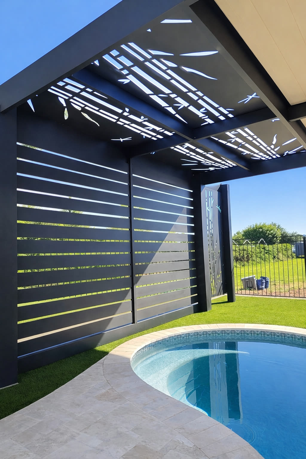Custom aluminum architectural feature over a pool water feature in Littleton, Colorado